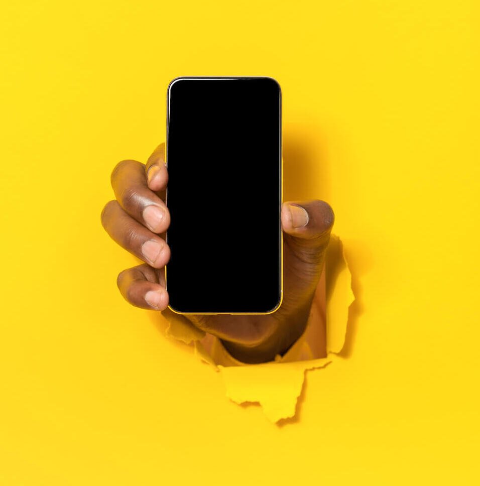mobile app closeup of black male hand holding cel 2023 11 27 05 30 22 utc 1 1 1.jpg